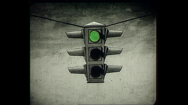 Ampel mit grünem Signal oben (Videostill/Österreichische Mediathek)